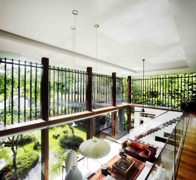 Glass balustrade The dual level home is kept open from floor to ceiling with the utilization of a mezzanine level, flanked by clear glass balustrades for unobstructed light flow and viewing capacity. Likewise, the exterior space enjoys a double level aspect from the exterior staircase, balconies and roof planting.